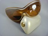 pair of brown sunglasses on a white case and a pair of brown sunglasses on a white case