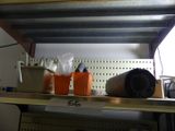 a shelf that has some cups and cups on it