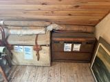 a small room with a wooden floor and a wooden wall