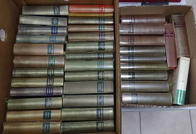 a box full of books that are sitting on the floor