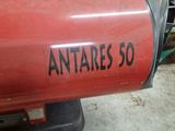 a red machine that is sitting in the garage