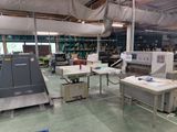a large room with many machines and tables in it