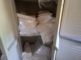 a closet full of towels and other items in it