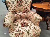 a chair that is sitting in the middle of a room