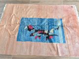 a rug on the floor that has a picture of two birds on it
