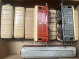 a box with a bunch of toy trains in it