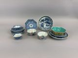 a group of blue and white dishes and bowls