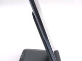 a cell phone that is sitting on top of a stand