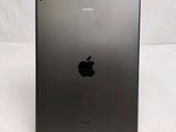 the back of an apple ipad with a black apple logo on it