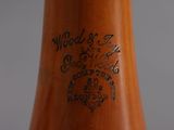 a close up of a wooden vase with writing on it
