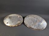 a pair of silver plated oval mirrors