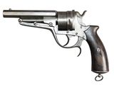 an old gun with a wooden handle on a white background