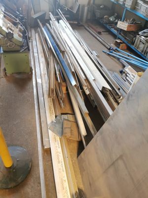 several pieces of wood are stacked on top of each other in a warehouse