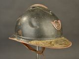 a helmet that is sitting on a stand on a gray background