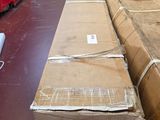 a large cardboard box sitting on the floor next to a pile of other boxes