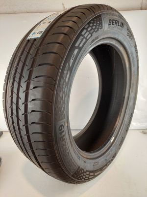 a close up of a tire on a white surface