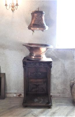 a large bell sitting on top of a table in a room