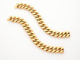 a pair of gold chain bracelets on a white background