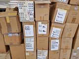 many boxes of shoes stacked on top of each other