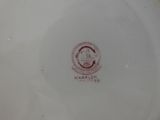 a close up of a plate with a picture of a man on it