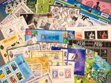 many different types of stamps and stamps on the table