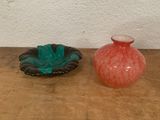 two vases sitting on a table next to each other