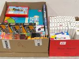 une boîte remplie de fournitures scolaires posée par terre à côté d'une boîte rouge