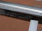 a close up of a metal object with a name on it