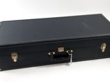 a black suitcase that is sitting on a white surface