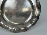a silver plate that is on a table