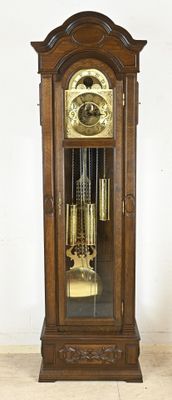 a grandfather clock that is on display in a room