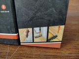 a black box with a picture of a house inside of it