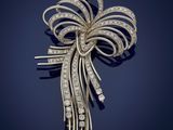 a diamond and gold broochle, by cartier