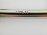 a close up of a metal handle on a white refrigerator