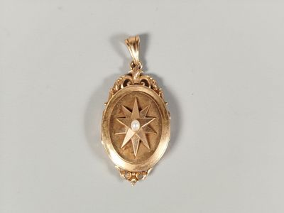 a close up of a gold locke with a star on it