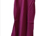 a purple dress hanging on a hanger on a white background