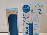 a blue electric toothbrush sitting next to a box