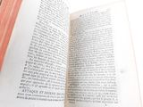 an open book that is sitting on a table