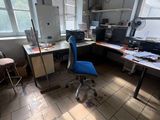 a room with a desk and a chair in it