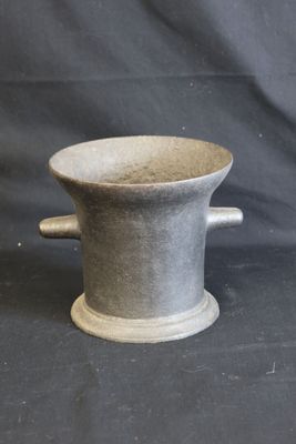 grey stoneware cup with handles and handles on a black background