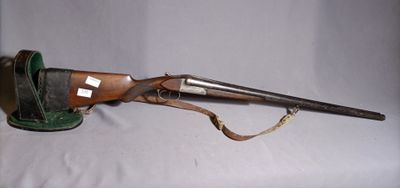an old rifle with a wooden barrel and a leather case