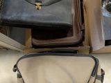 two bags sitting on top of each other in a box