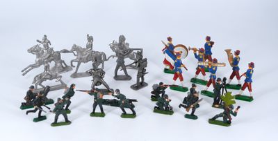 a lot of toy soldiers that are on a white surface
