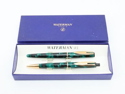 two pens in a box with a blue box on a white background