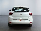 the rear end of a white car in a white room