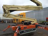 a crane that is sitting in the middle of a parking lot