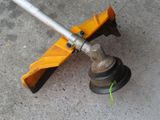 a close up of a hose with a handle on the ground