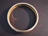 a close up of a wedding ring on a table