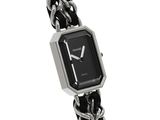 a black and silver watch with a chain around it