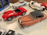 many toy cars that are sitting on a table